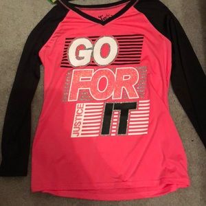 A pink long sleeve shirt from justice.